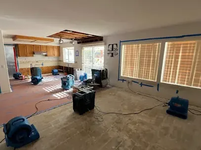 Water damage restoration underway inside a commercial space