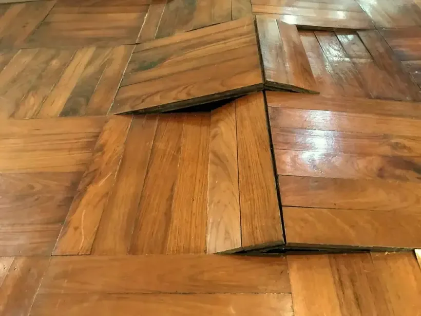 Oak parquet flooring buckled after water soaked in from underneath